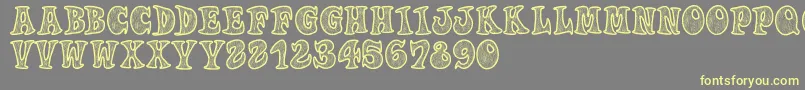 Woodys Font – Yellow Fonts on Gray Background