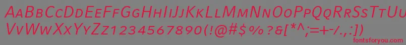 CompatilFactLtComItalicSmallCaps Font – Red Fonts on Gray Background