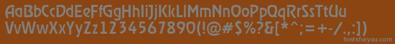 ARewindermedium-fontti – harmaat kirjasimet ruskealla taustalla