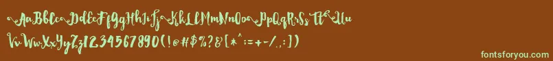 フォントDality – 緑色の文字が茶色の背景にあります。