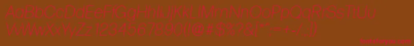 フォントFormulaserialXlightItalic – 赤い文字が茶色の背景にあります。