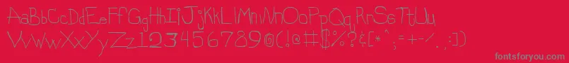 フォントStinky – 赤い背景に灰色の文字
