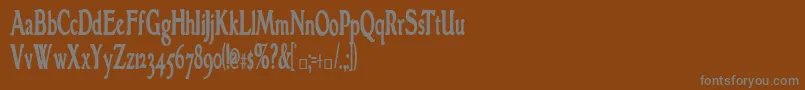 GranthamcondensedBold-fontti – harmaat kirjasimet ruskealla taustalla