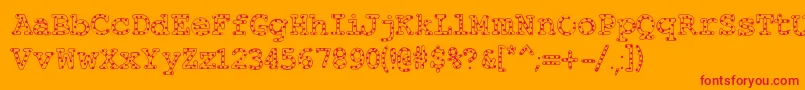 Alphabeticsprinkles-Schriftart – Rote Schriften auf orangefarbenem Hintergrund