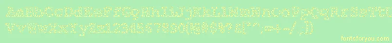 Fonte Alphabeticsprinkles – fontes amarelas em um fundo verde