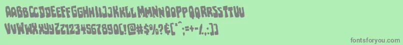 Pocketmonsterrotate-Schriftart – Graue Schriften auf grünem Hintergrund