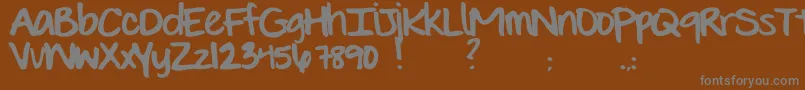 Шрифт EvieSHand – серые шрифты на коричневом фоне