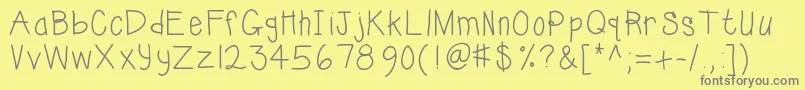 Kbsunshinebold-fontti – harmaat kirjasimet keltaisella taustalla