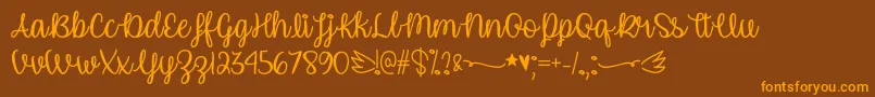 UnicornCalligraphyOtf Font – Orange Fonts on Brown Background