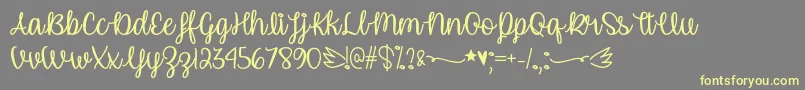 UnicornCalligraphyOtf Font – Yellow Fonts on Gray Background