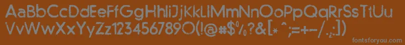 Llfutur-fontti – harmaat kirjasimet ruskealla taustalla
