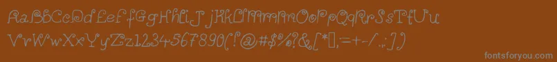 Alittlescribbleinmybook Font – Gray Fonts on Brown Background