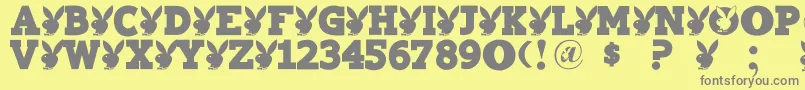 Playtoy-fontti – harmaat kirjasimet keltaisella taustalla