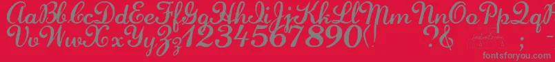 Laurenscript-fontti – harmaat kirjasimet punaisella taustalla