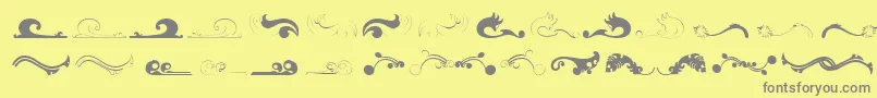 Felicity-fontti – harmaat kirjasimet keltaisella taustalla