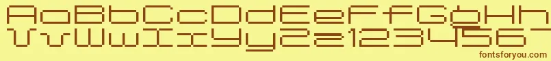 フォントSpreadbita10 – 茶色の文字が黄色の背景にあります。
