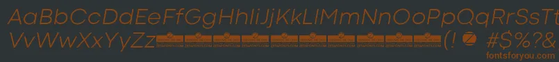 CodecColdLightItalicTrial-fontti – ruskeat fontit mustalla taustalla