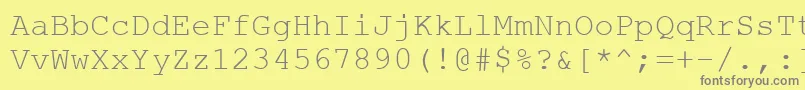 フォントCourtiercRegular – 黄色の背景に灰色の文字