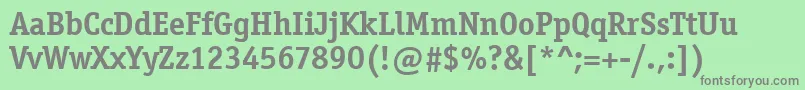 OfficinaSerifItcTtBold-fontti – harmaat kirjasimet vihreällä taustalla