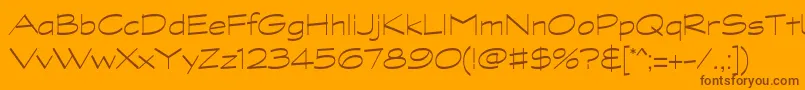 GraphitestdLightwide-Schriftart – Braune Schriften auf orangefarbenem Hintergrund