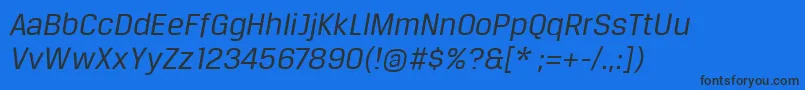 BreuertextItalic-fontti – mustat fontit sinisellä taustalla