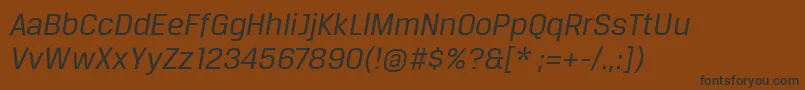 BreuertextItalic-fontti – mustat fontit ruskealla taustalla