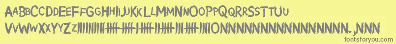 フォントWritingWithoutInk – 黄色の背景に灰色の文字
