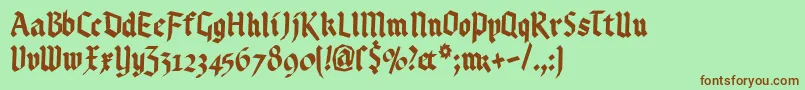 Kleinsbrokengotik Font – Brown Fonts on Green Background