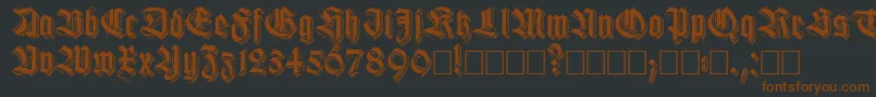 Шрифт Killigrewstacatto – коричневые шрифты на чёрном фоне