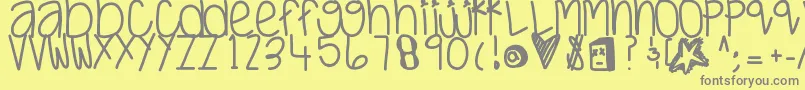 Justwaitandsee-fontti – harmaat kirjasimet keltaisella taustalla