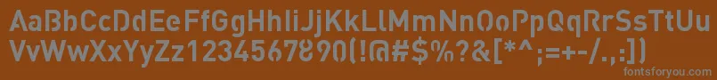 StreetvertisingBoldPublic-fontti – harmaat kirjasimet ruskealla taustalla