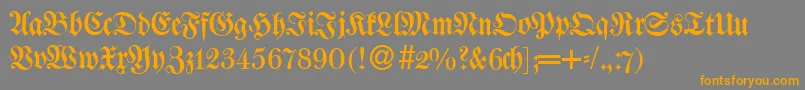フォントW650BlackletterRegular – オレンジの文字は灰色の背景にあります。