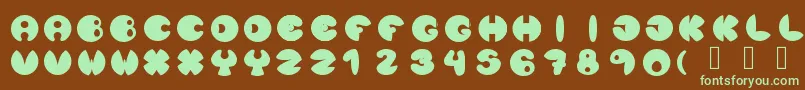 フォントLunanuevatype – 緑色の文字が茶色の背景にあります。