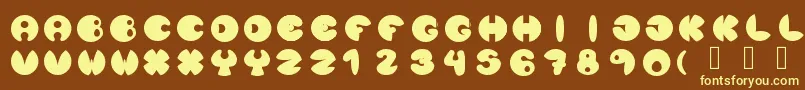 Lunanuevatype-fontti – keltaiset fontit ruskealla taustalla