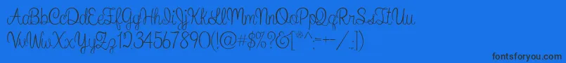 WhatIWantForChristmas-Schriftart – Schwarze Schriften auf blauem Hintergrund