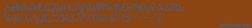 WhatIWantForChristmas-Schriftart – Blaue Schriften auf braunem Hintergrund