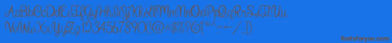 フォントWhatIWantForChristmas – 茶色の文字が青い背景にあります。