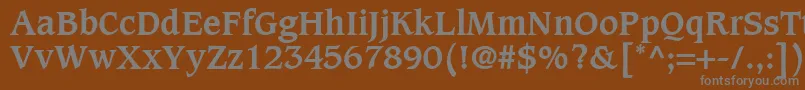 CaxtonLtBold-fontti – harmaat kirjasimet ruskealla taustalla