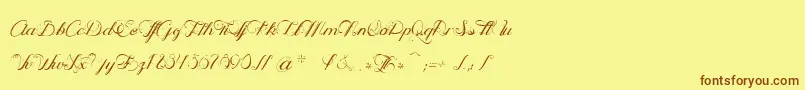 OphРІliaScript Font – Brown Fonts on Yellow Background