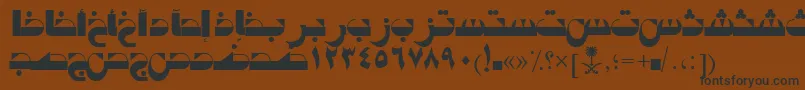 AymTabukSUNormal.-Schriftart – Schwarze Schriften auf braunem Hintergrund