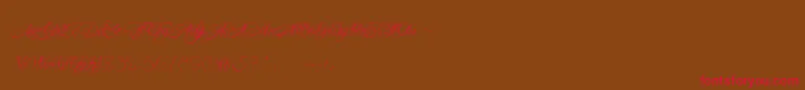 MademoiselleCamille-Schriftart – Rote Schriften auf braunem Hintergrund