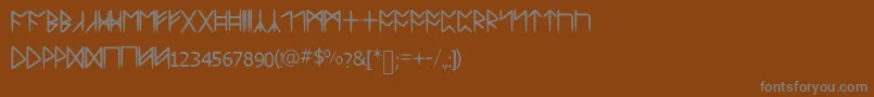 フォントStandardcelticrune – 茶色の背景に灰色の文字