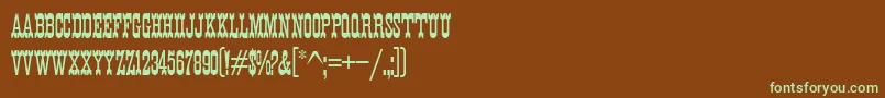 フォントK22EurekaNofrills – 緑色の文字が茶色の背景にあります。