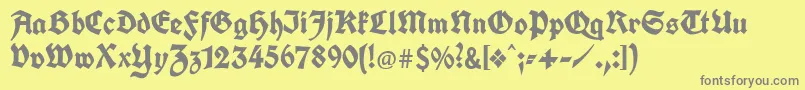 Шрифт Unifrakturcook – серые шрифты на жёлтом фоне