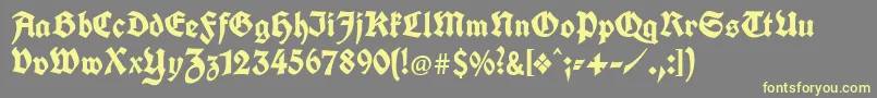 Unifrakturcook Font – Yellow Fonts on Gray Background
