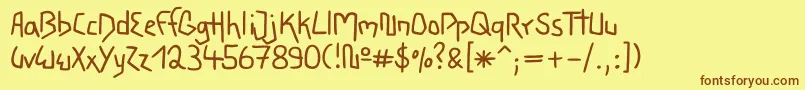 フォントWacky – 茶色の文字が黄色の背景にあります。