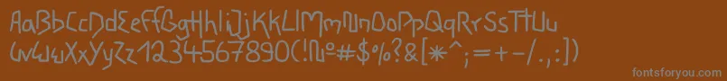 フォントWacky – 茶色の背景に灰色の文字