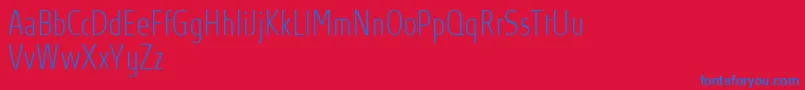 AbsolutProThincondensed-Schriftart – Blaue Schriften auf rotem Hintergrund