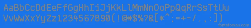 KlartextMonoMedium-fontti – harmaat kirjasimet sinisellä taustalla