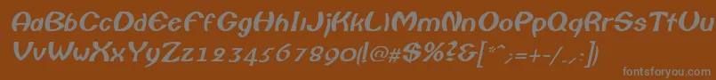 ColumboItalic-fontti – harmaat kirjasimet ruskealla taustalla